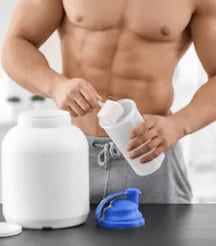 Rice Protein Powder Benefits - man taking protein powder