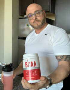 What Is a Intra Workout - me holding my bcaa