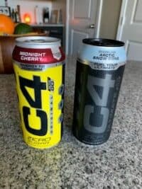 C4 Energy Drink Reviews - me holding c4 on the go - cans of C4 energy drink