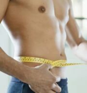 What is casein protein powder - man measuring stomach