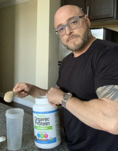 What Is Organic Protein Powder - me mixing orgain organic protein powder