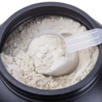 Pre Workout VS Post Workout Supplements - scoop of protein powder