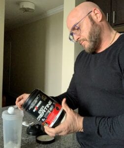 What Is A Post Workout Supplement - me scooping creatine